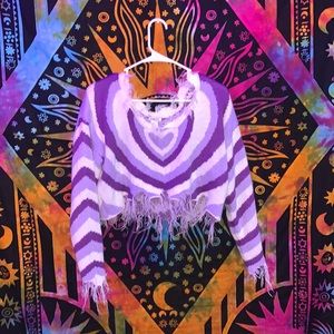 it’s from rule 21 in size medium and the colors are purple and white